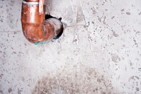 copper pipe leaking in a wall